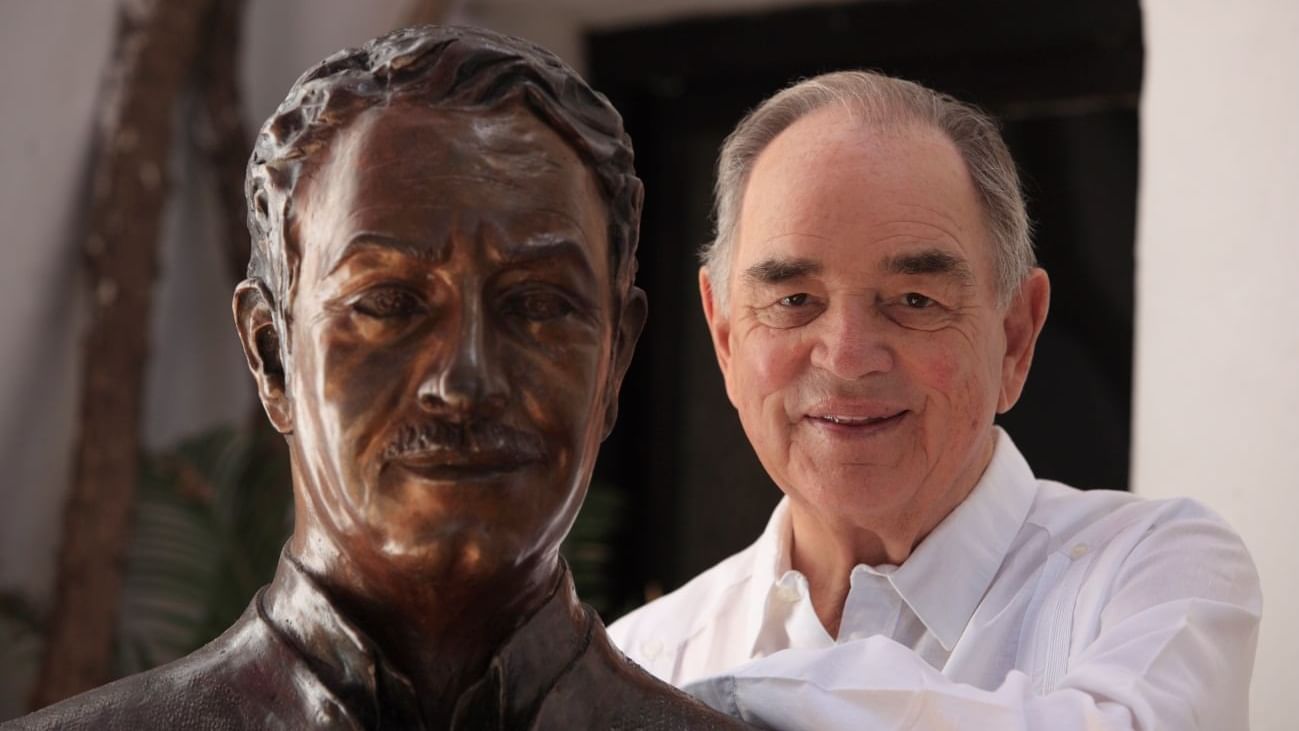 Headshot of a man posing near a statue at Marbella Club Hotel