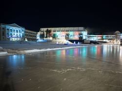 Speed skating oval at the Olympic Center at night.