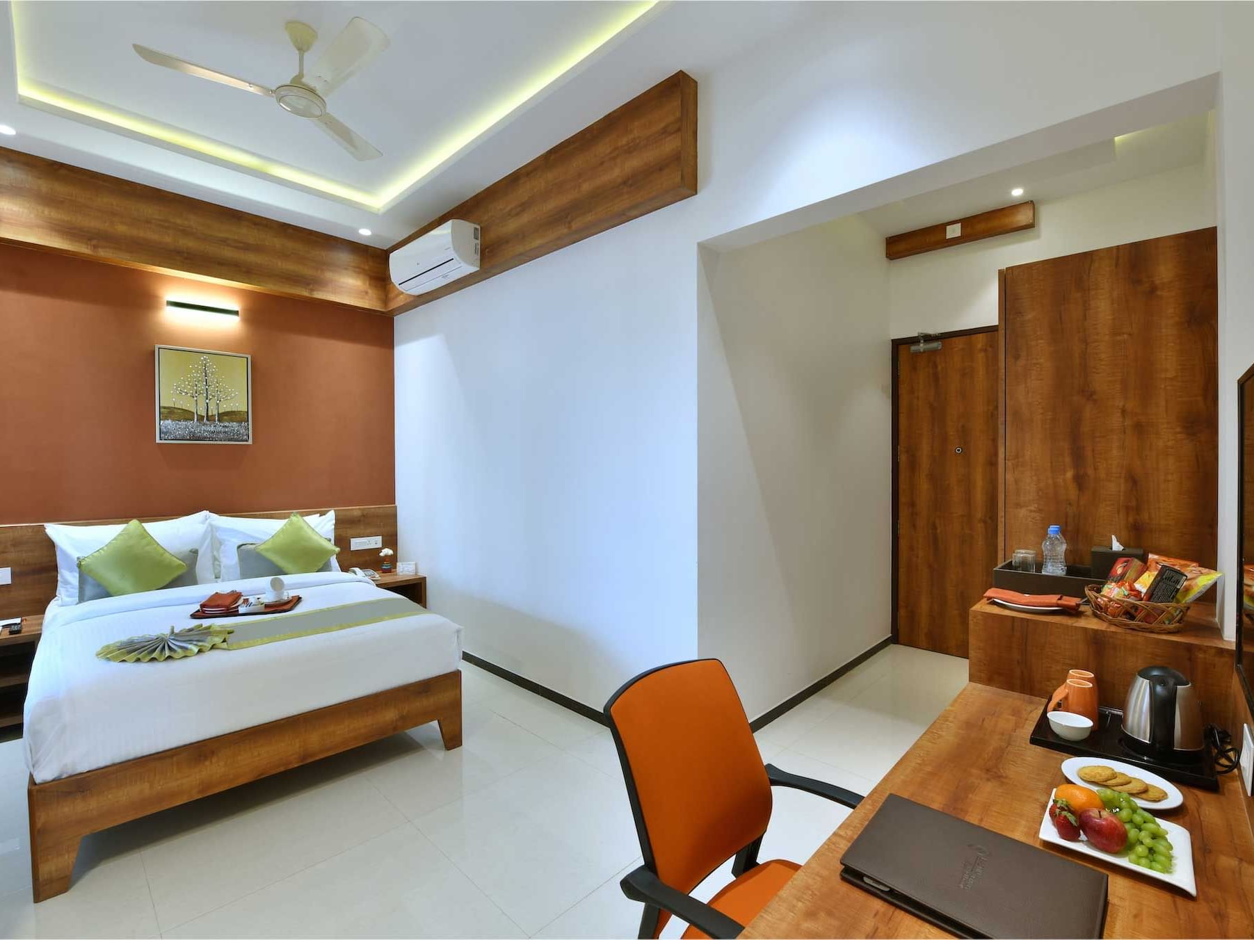 Bed & furniture in Deluxe Rooms at Eastin Hotels