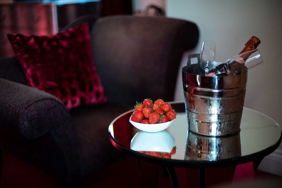 A silver bucket a bottle of wine & fresh strawberries served at Orsett Hall Hotel