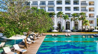 Pool with sunbeds & umbrella's at The Danna Langkawi