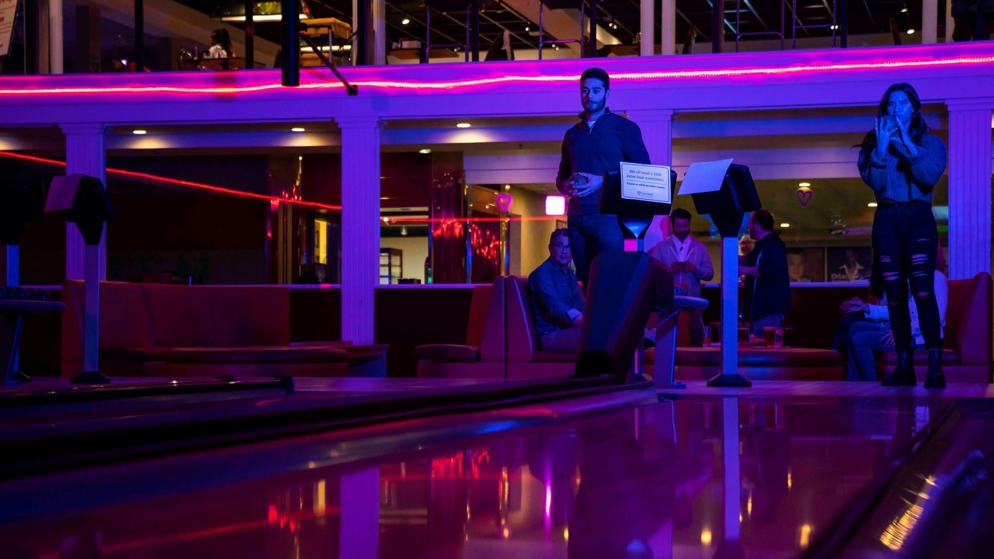 People gathered for a Bowling Alley, featuring Top Indoor Activities for Couples at Cove Pocono Resorts