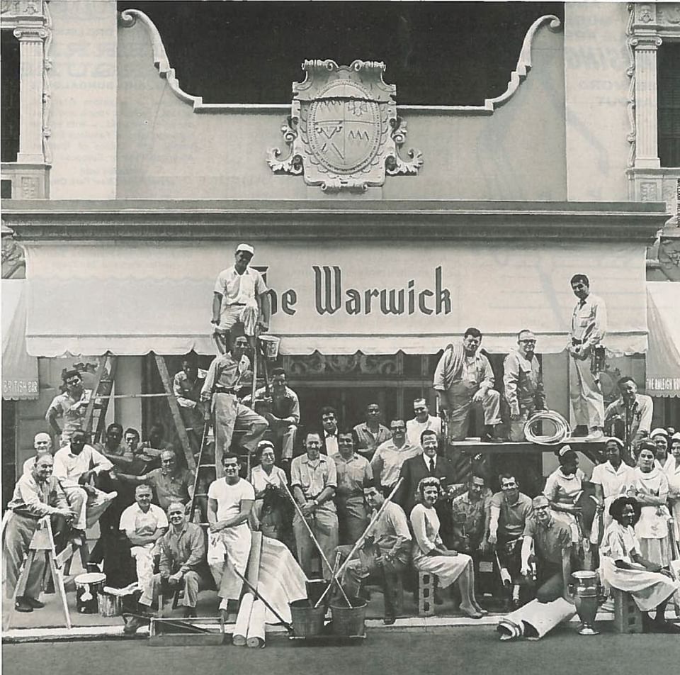 Historic black and white photo of the original hotel staff at the Warwick New York