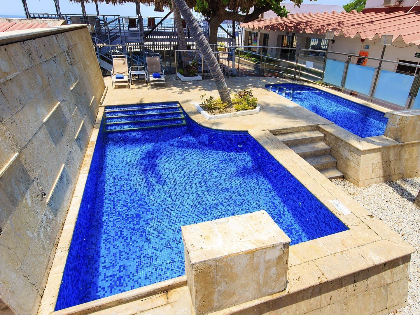 Outdoor mini pool with sunbeds at GIO Hotel Santa Marta Tama