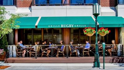 People dining outside at the rugby grille at The Townsend Hotel