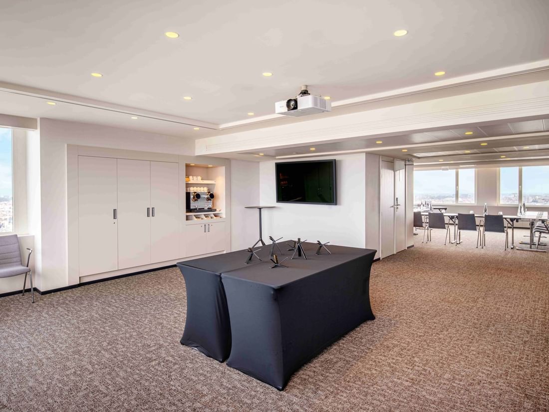Meet 25 Three Meeting room with a projector, screen, and city view at The Hotel Brussels