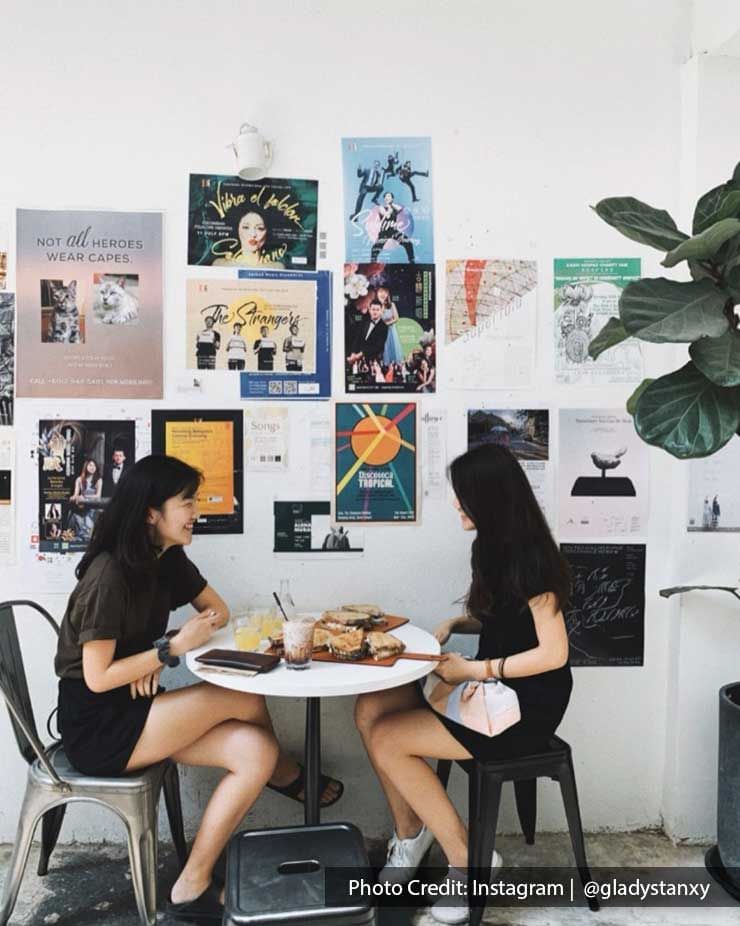 Ladies dining by a wall of pictures in a Restaurant near Imperial Lexis Kuala Lumpur, KL Food Guide