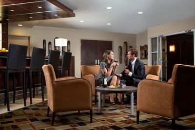 A Couple in the Hospitality Suite at Metterra Hotel on Whyte