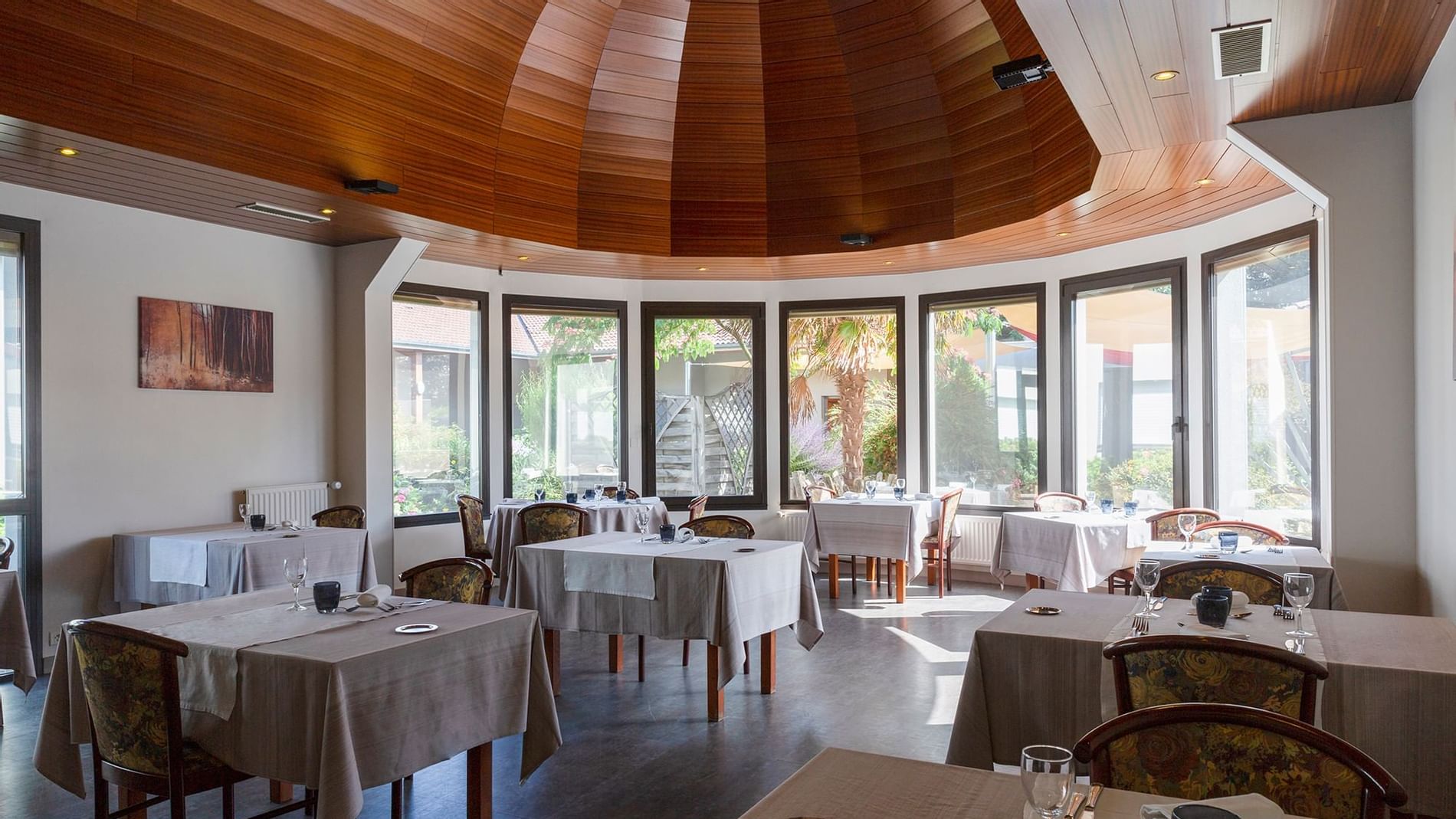 Dining table setup in hotel Restaurant at Originals Hotels