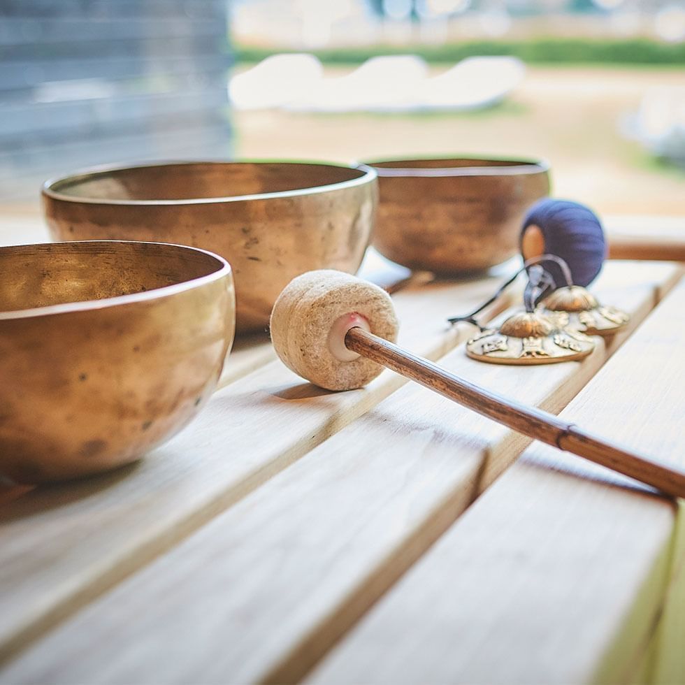 Close-up of singing bowls in a spa at Falkensteiner Hotels