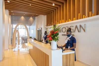 Receptionists behind the desk at The Morgan Resort Spa Village