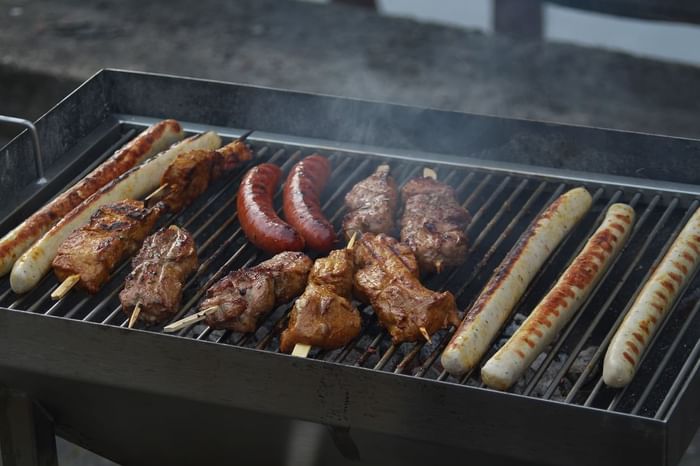 Close-up of a BBQ grilling at 3C Hotels