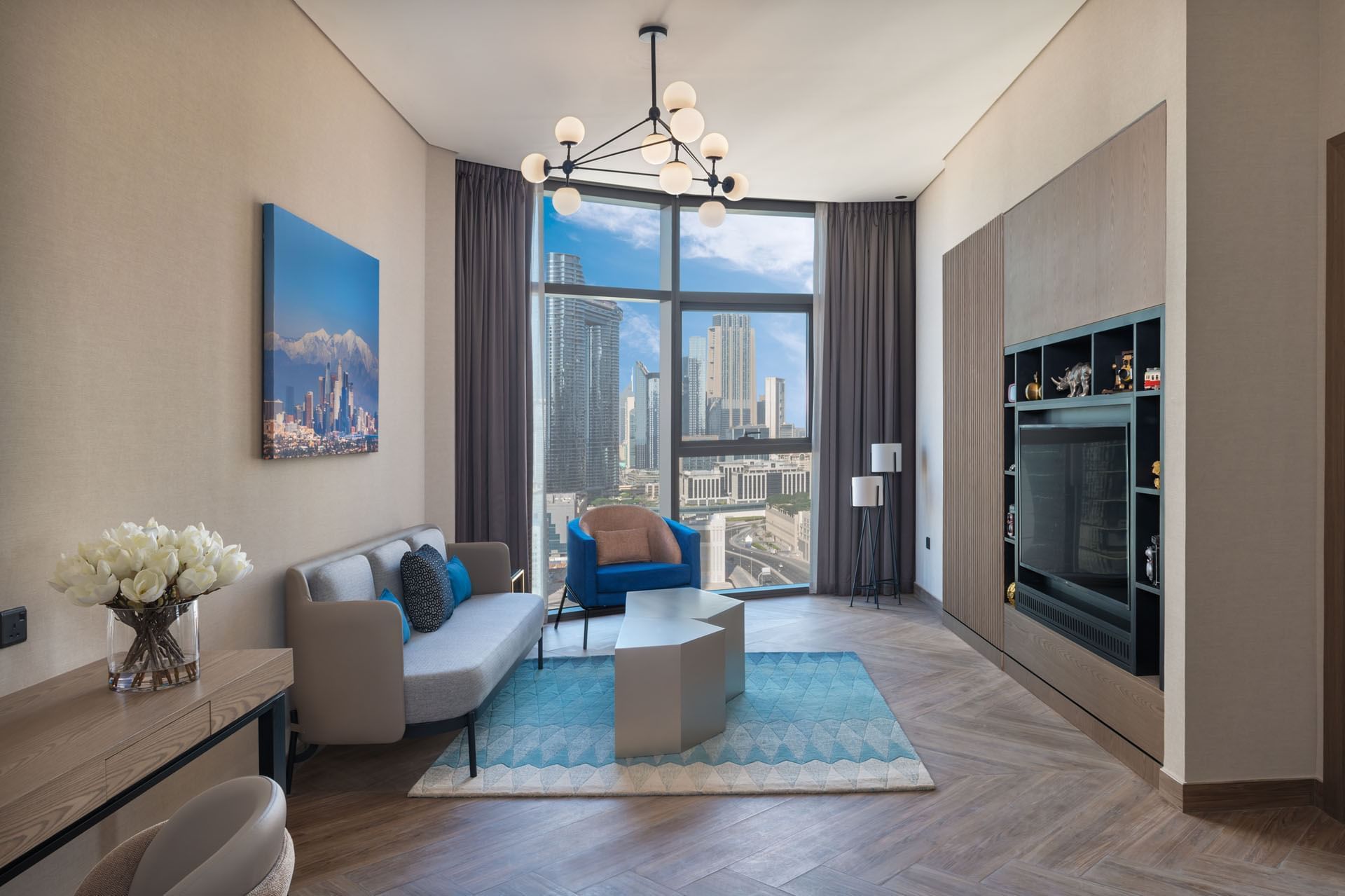 Spacious living area with city view and TV in Paramount Suite at Paramount Hotel Midtown
