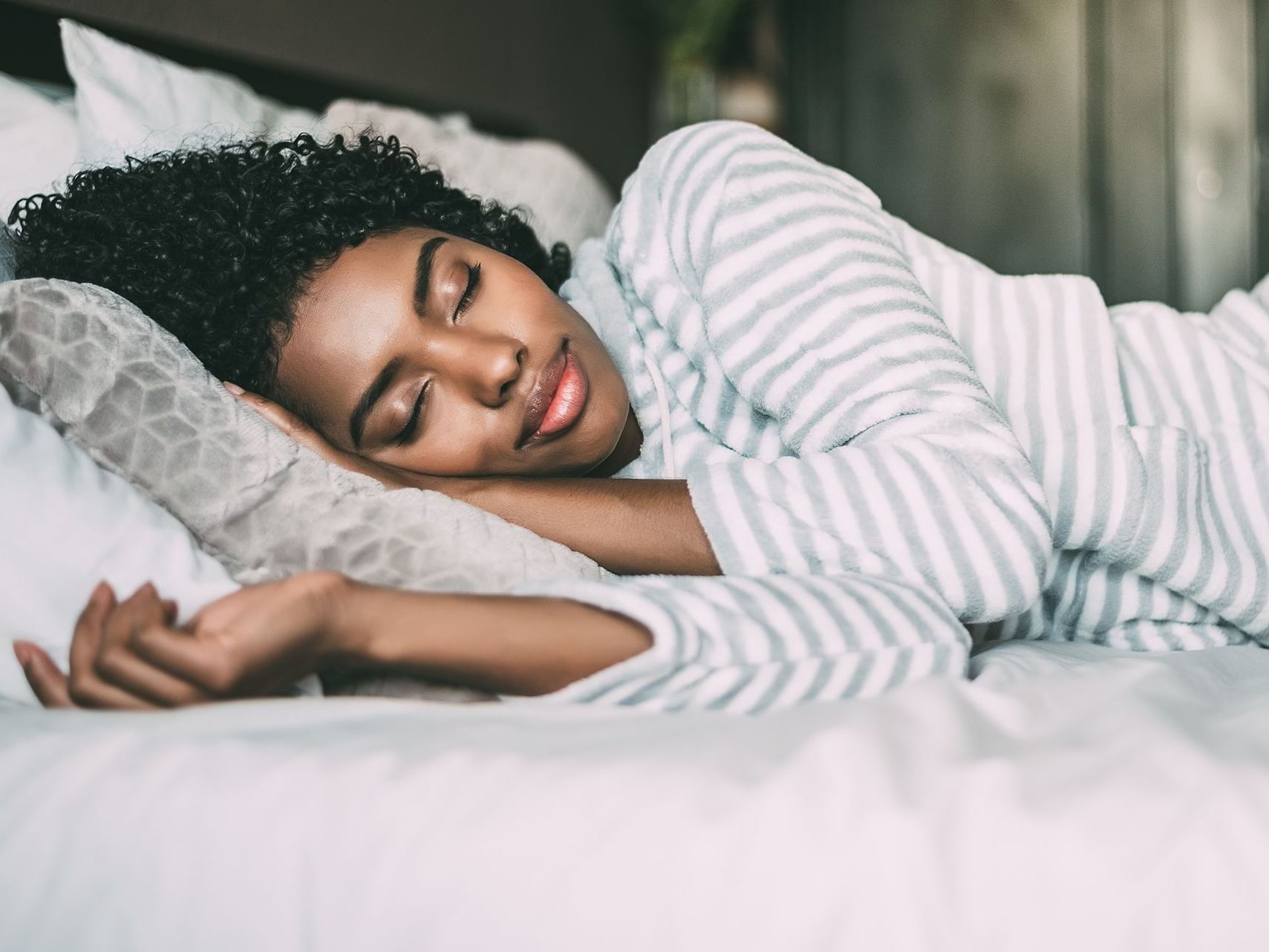 close up of a black woman sleeping at Dream Hollywood LA