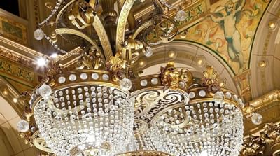Closeup of an chandelier in the ceiling at Hilton Paris Opera