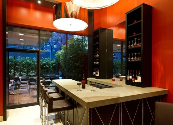 stools at a bar in a hotel