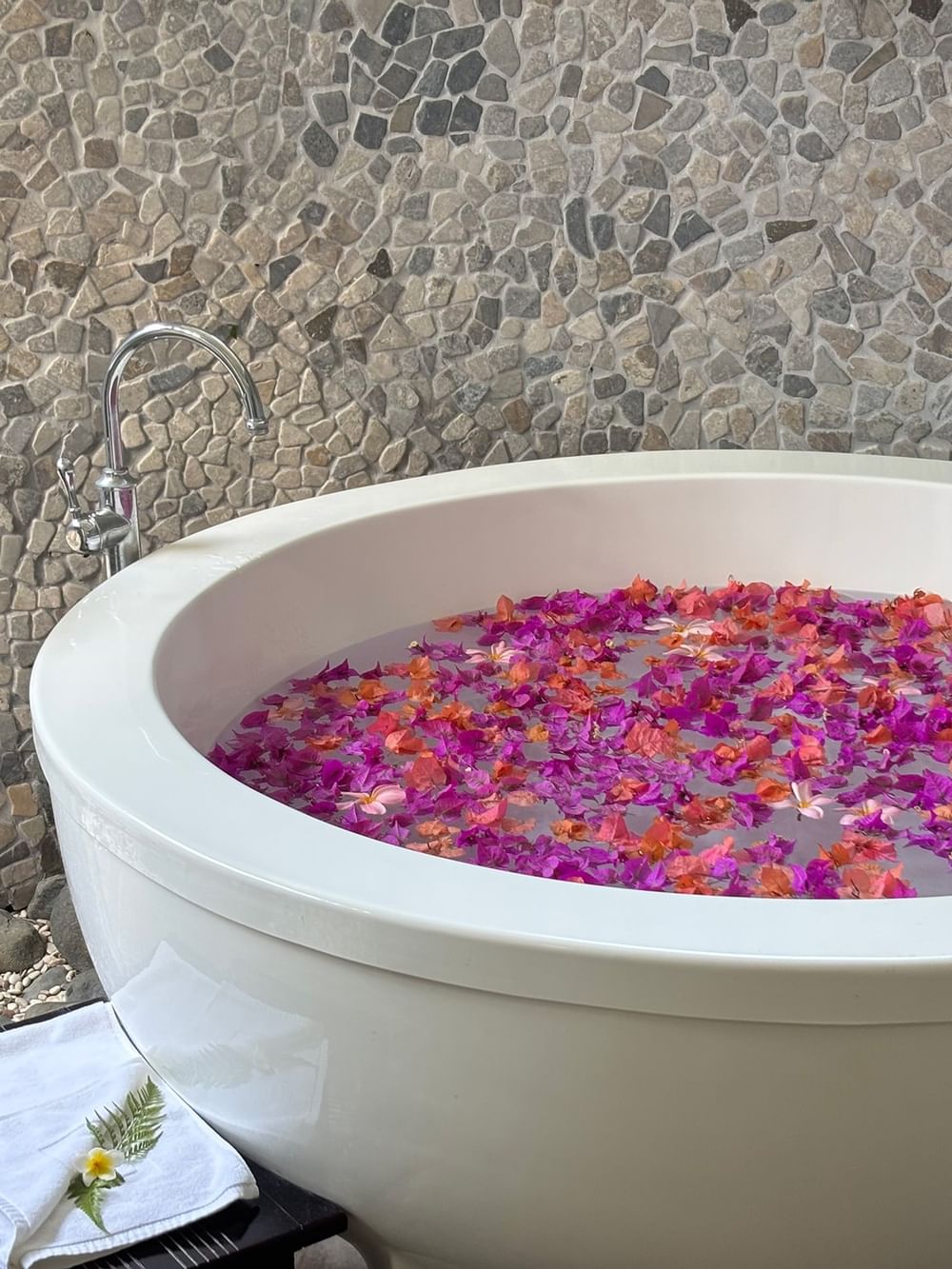 Bath tub with petals at Efate Pool Villa in Warwick Le Lagon Vanuatu.