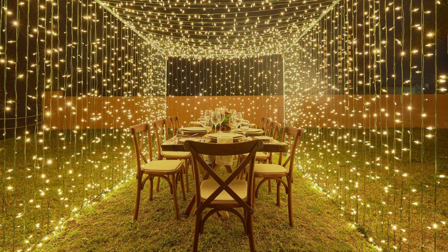 Open air dining table decorated with lights at GFA Veracruz