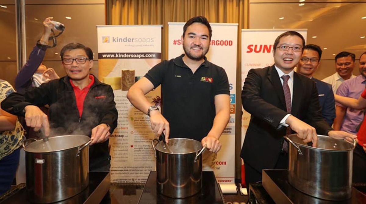 3 gentlemen posing in a food donation program at Sunway Lagoon