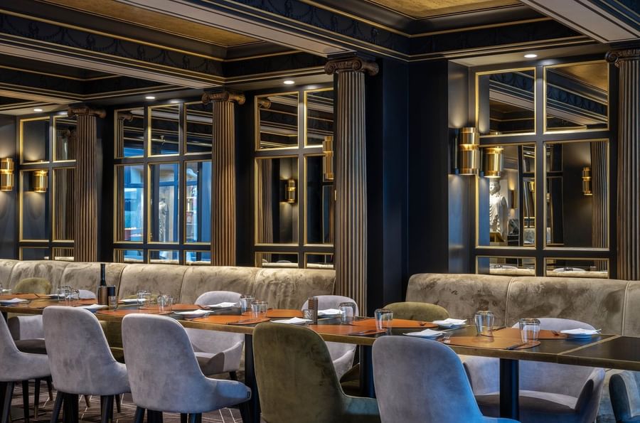 Long dining table set for a formal meal in Restaurant & Bar at Hotel Barsey by Warwick 