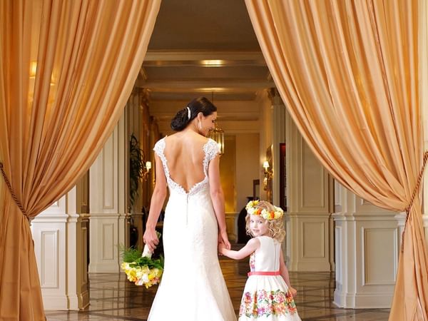 Portrait of a bride holding a kid at Warwick Melrose Dallas