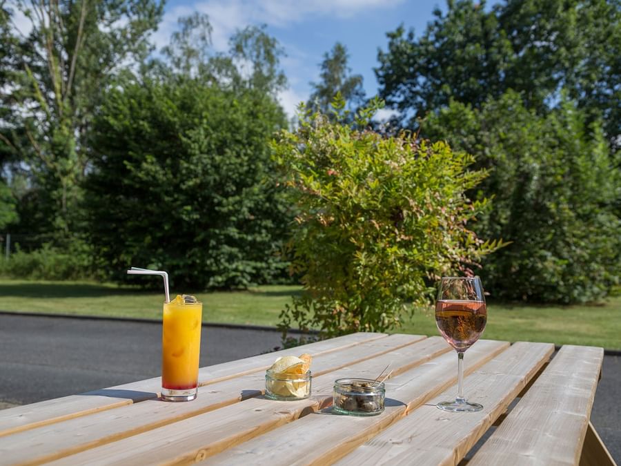 Drinks set on a Bench outdoors at Hotel Amys