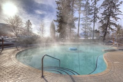 A relaxing hot tub surrounded by calm nature at Fairmont Hot Springs Resort