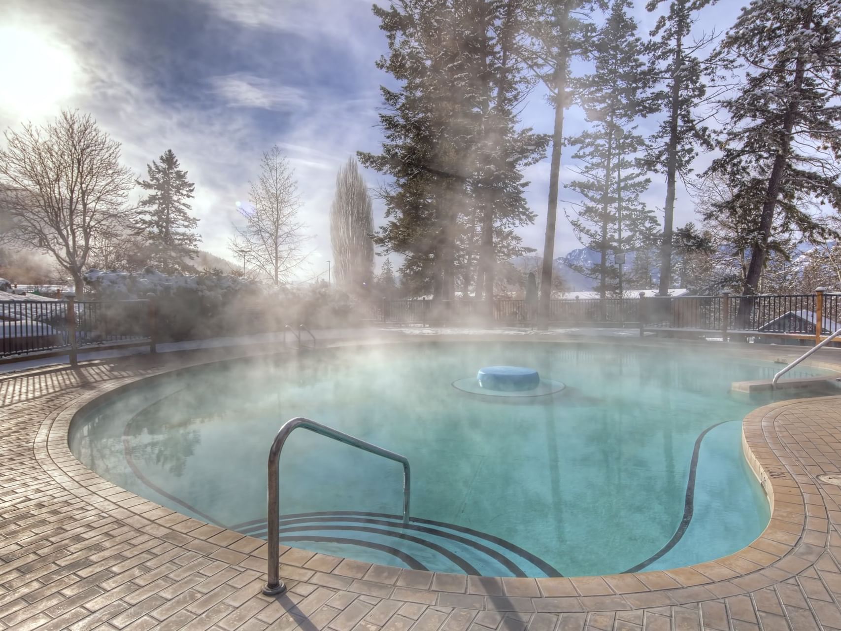 A relaxing hot tub surrounded by calm nature at Fairmont Hot Springs Resort