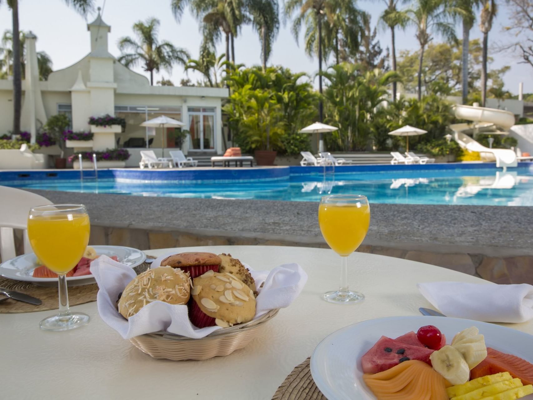 Breakfast served by the outdoor pool at Gamma Hotels