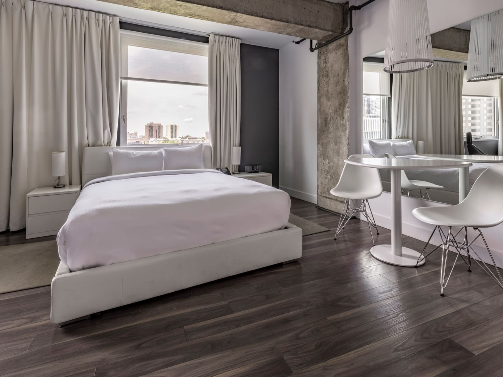 Queen bed with chair & table in ZERO1 LOFT at Hotel Zero1