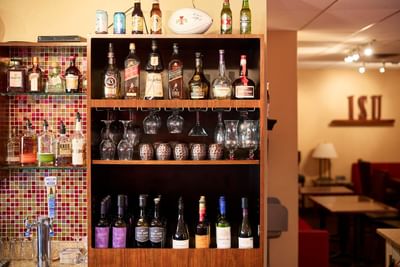 A wine shelf in the bar at The IowaStater Restaurant