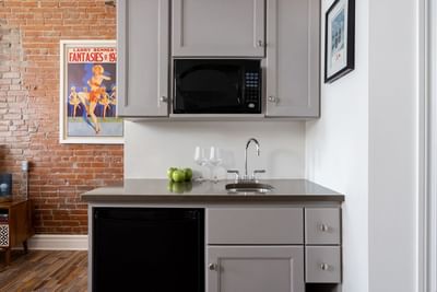 Kitchen area with pantry & wall pictures in Superior Loft at Retro Suites Hotel