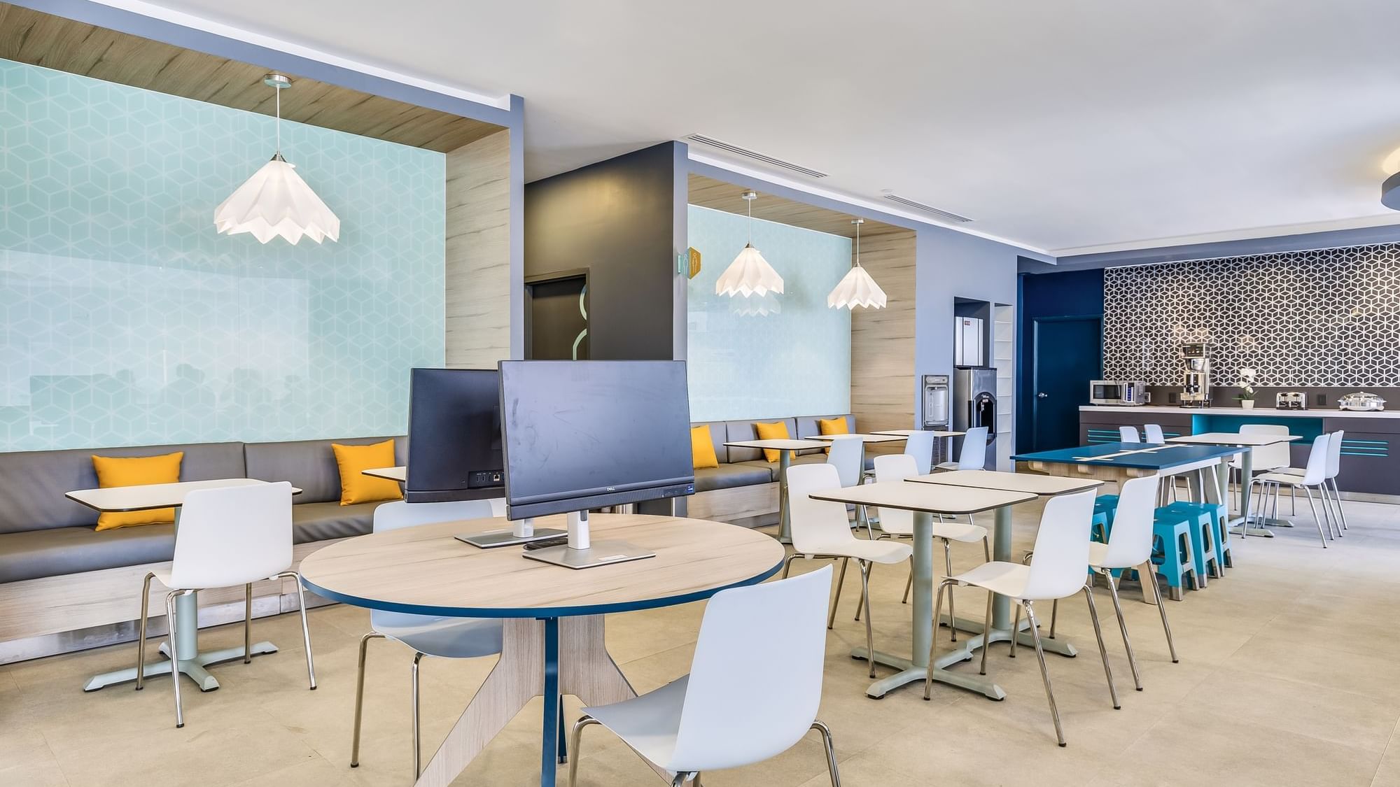 Buffet spread with variety of food items by dining area at One Acapulco Costera