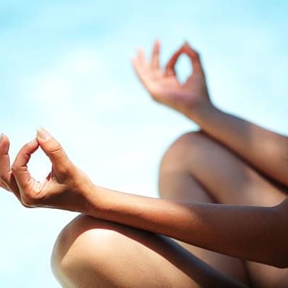 Lady practicing Rooftop yoga at Costa Beach Resort