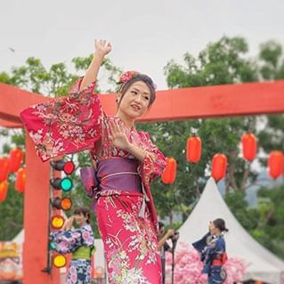A lady is dancing in japanese yukatas during Penang Bon Odori Festival