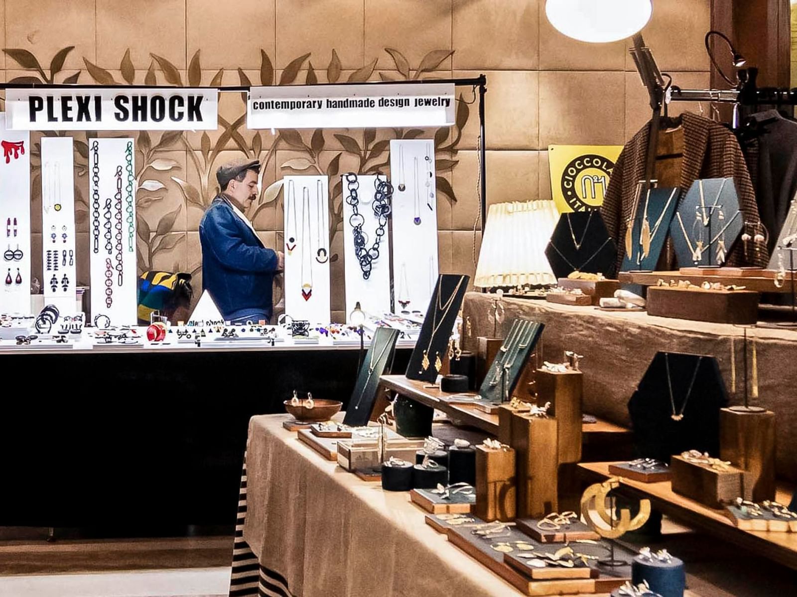 Jewelry vendor showcasing a variety of contemporary handmade designs in a Monti Urban Market near The Glam Hotel