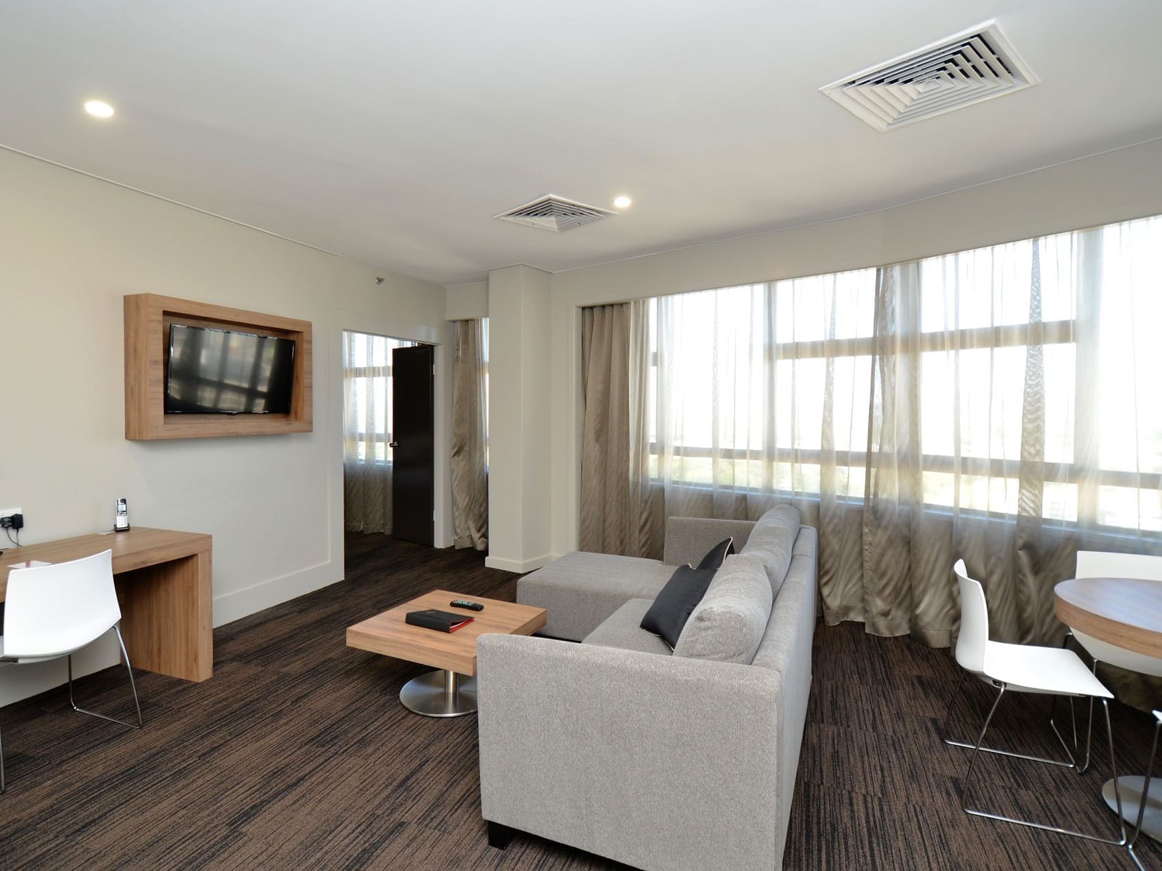 Lounge & desk in Executive Suite at Grand Chancellor Townsville