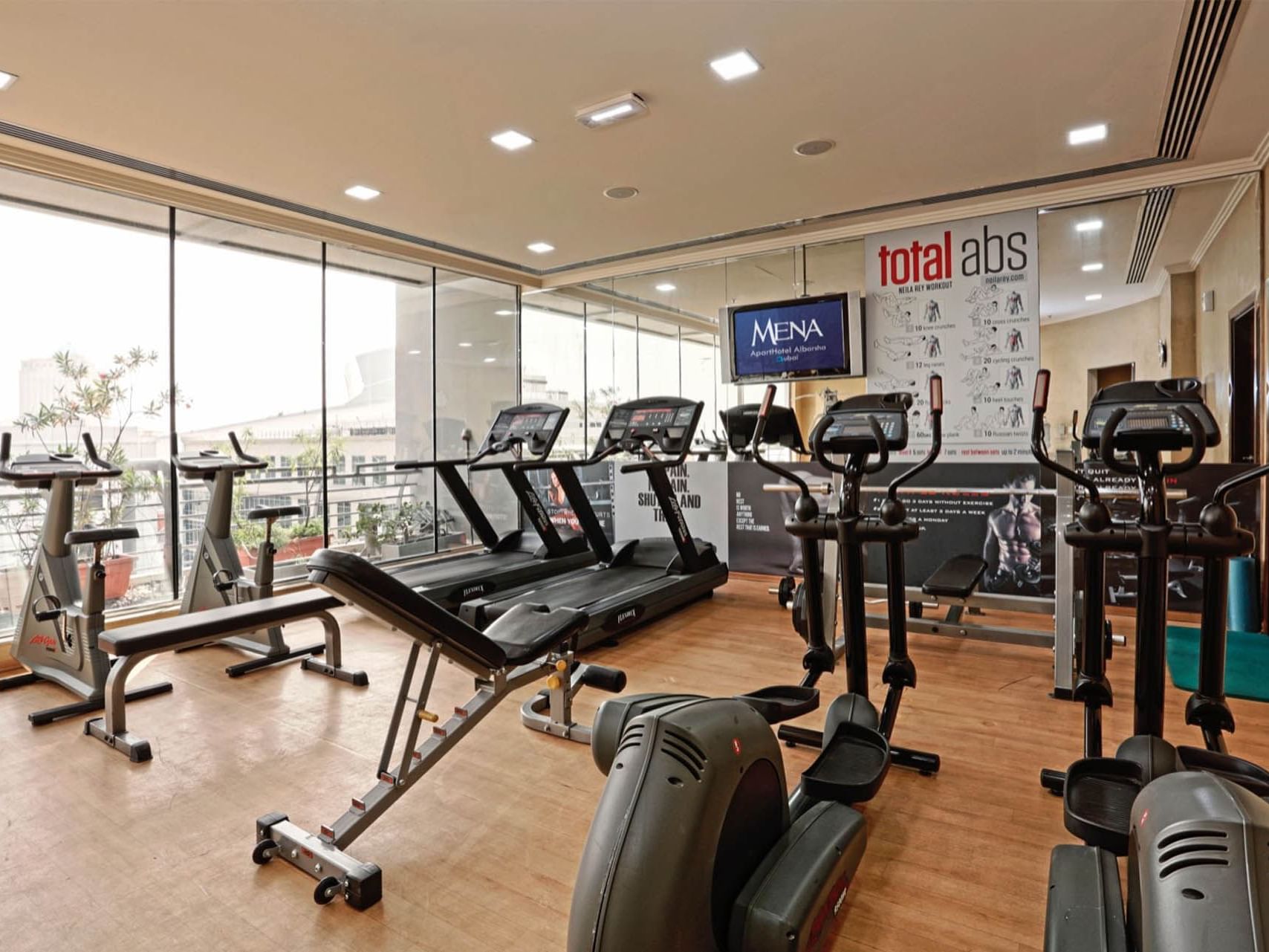 Fully equipped gym at Mena ApartHotel Albarsha Dubai
