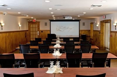 Meeting room lined with tables.