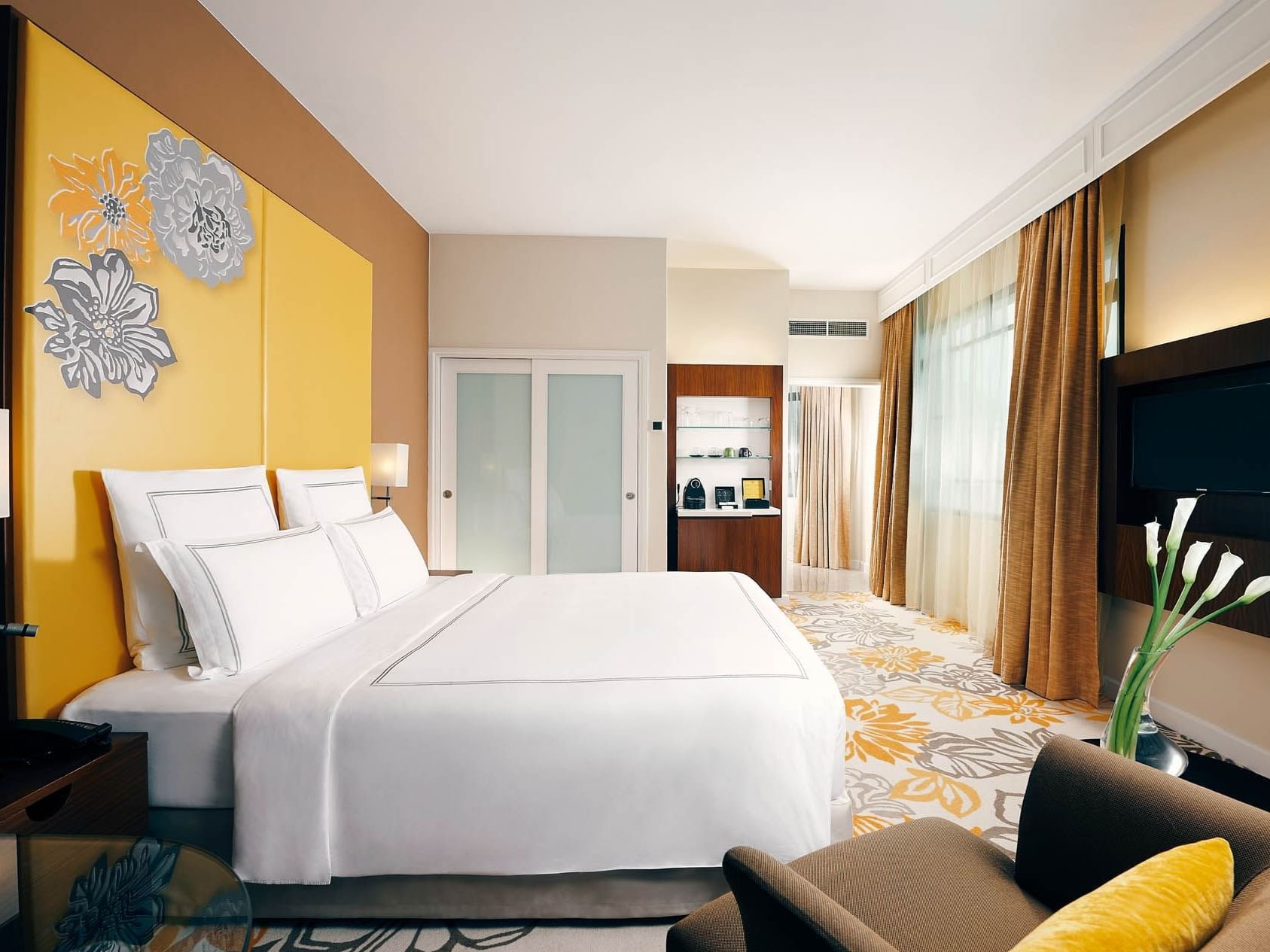 King bed, TV & chair in Executive Room at Paradox Singapore