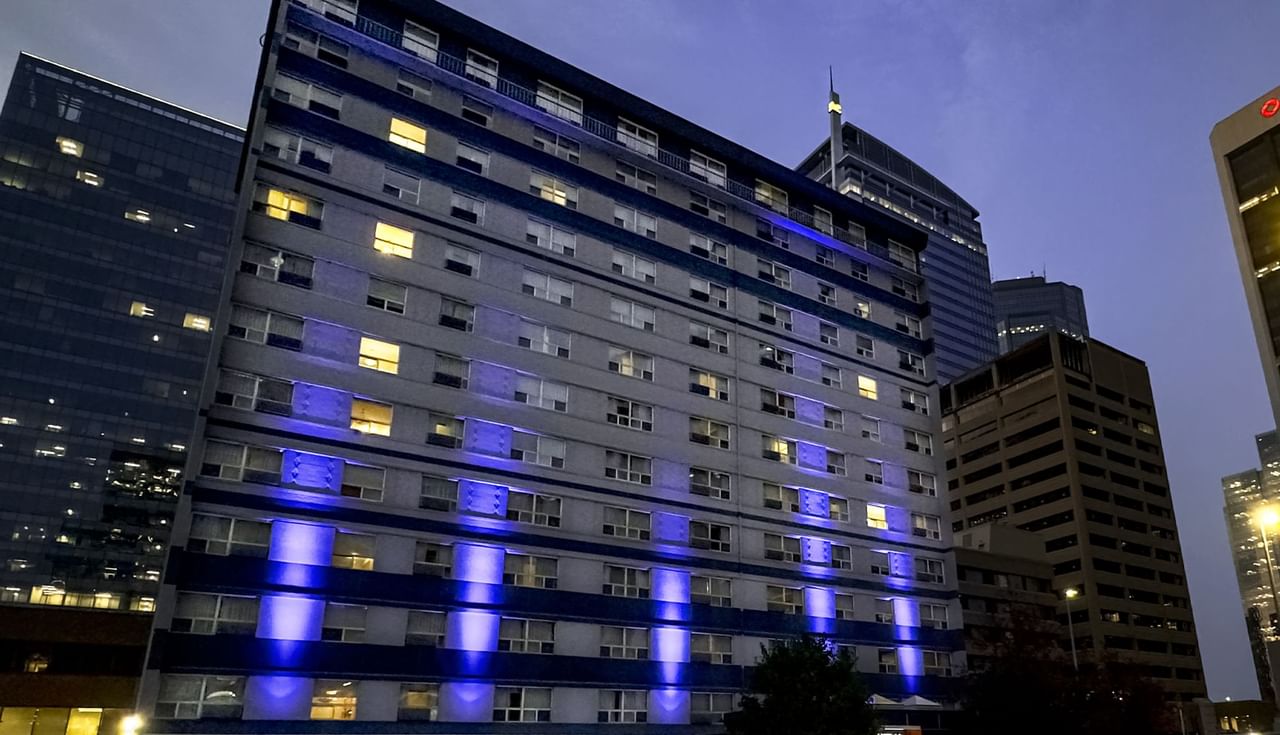 Exterior of Coast Calgary Downtown Hotel & Suites by APA at night