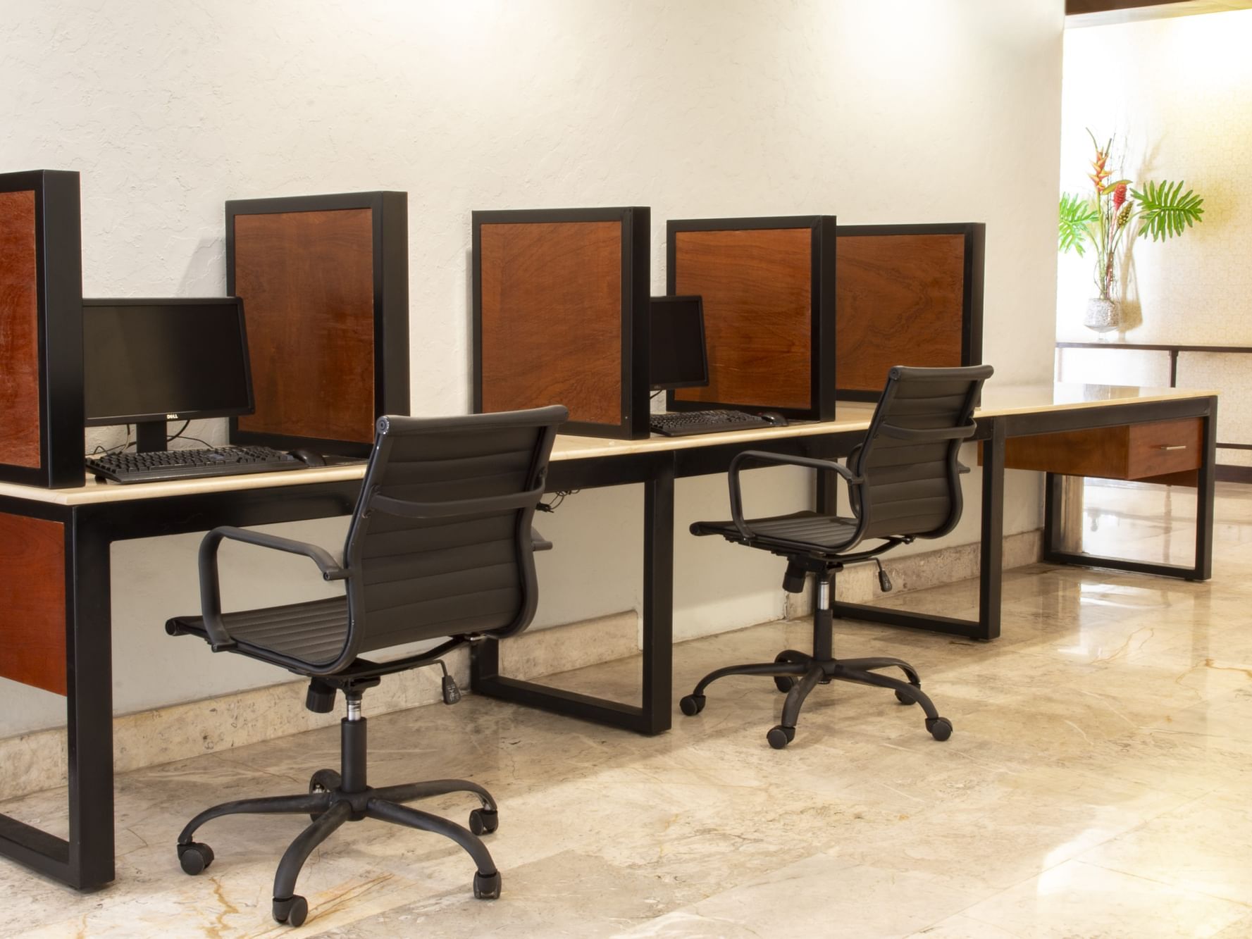 Desks & computers in a Business center at Gamma Hotels