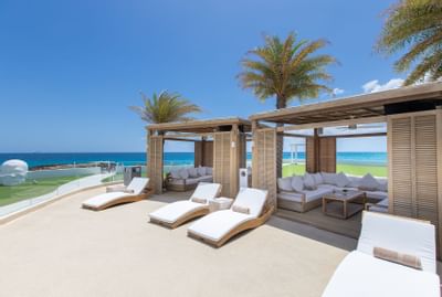 Cabana with lounge-style couches, The Morgan Resort Spa Village
