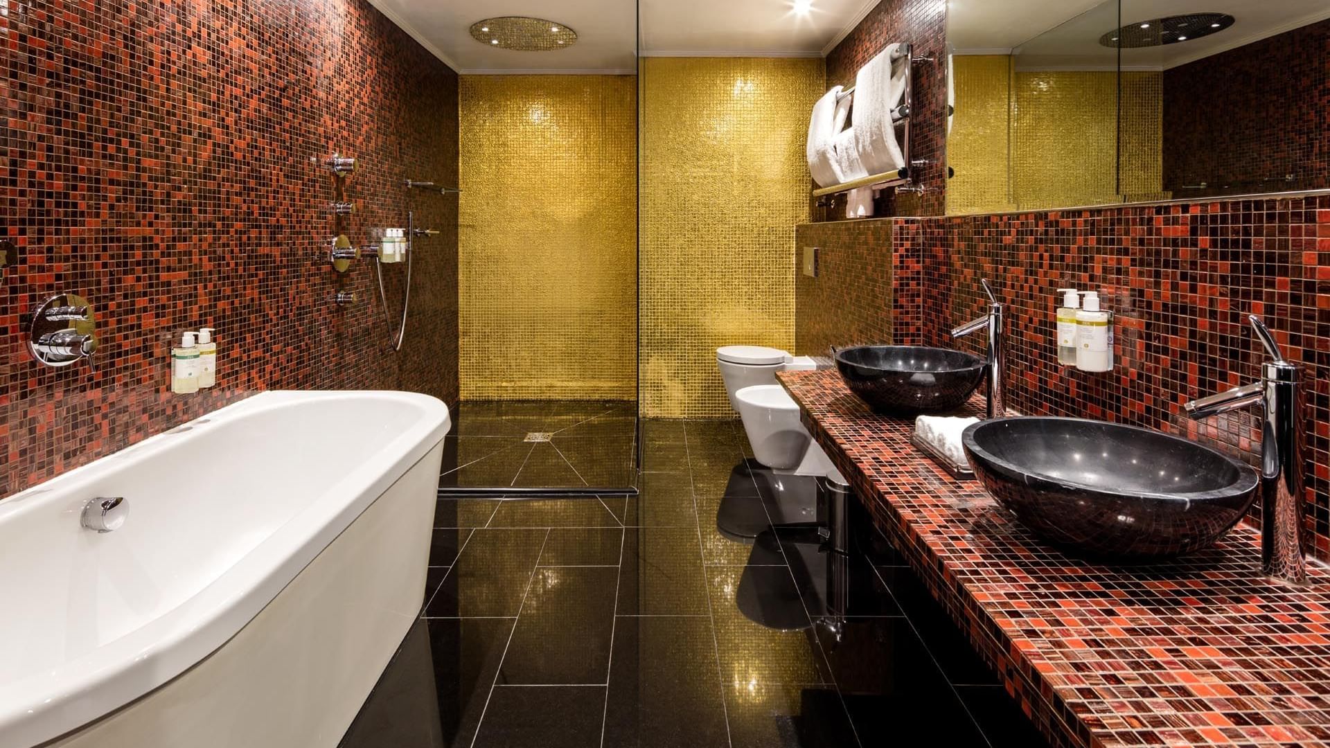 Lavish bathroom in The Opium Suite at The May Fair Hotel London featuring a modern sink and a freestanding bathtub