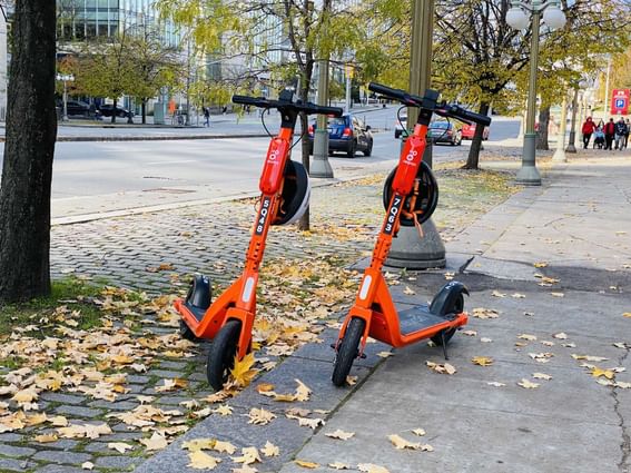 Electronic scooters parked outside the hotel at ReStays Ottawa