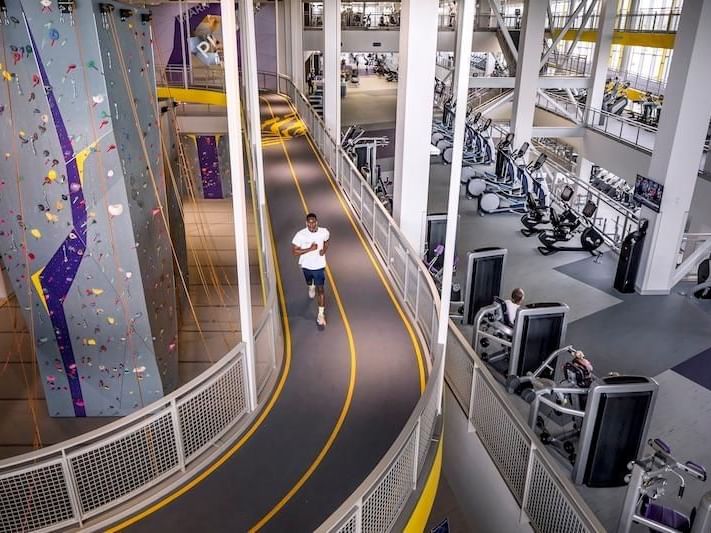 Man running in indoor track