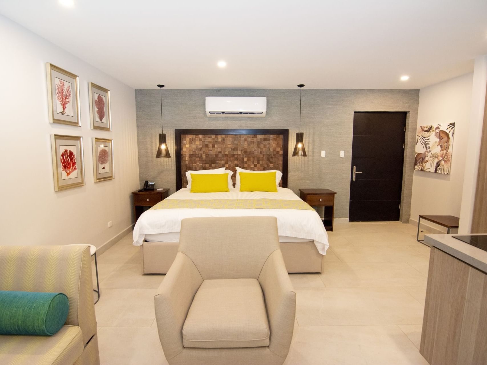 Lounges by the king bed in Titi Suites at Jungle Vista Boutique Hotel