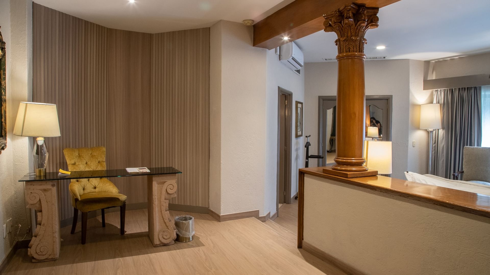 King Governor Suite with ornate column, work desk, and elegant seating area at Quinta Real Guadalajara