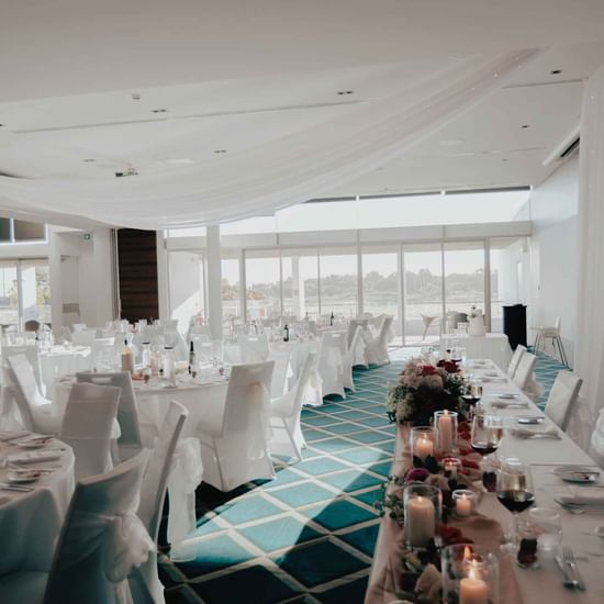 Well-arranged wedding dining tables at Pullman Magenta Shores