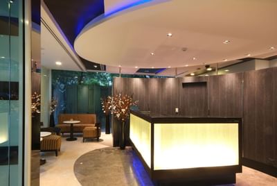 Lobby area with front desk at Amora Neoluxe Hotel Bangkok